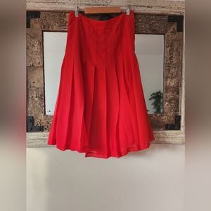 Red pleated skirt